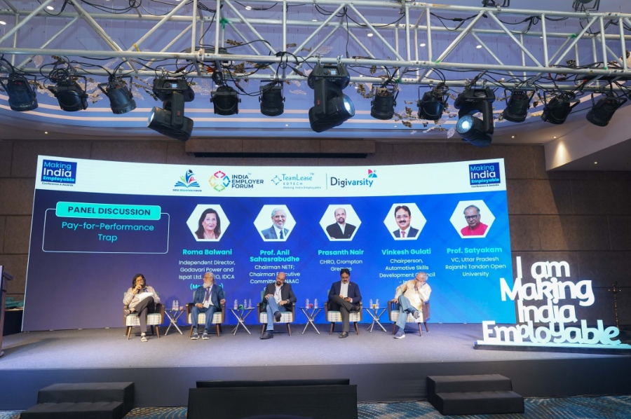 Wide panel discussion stage at MIECA